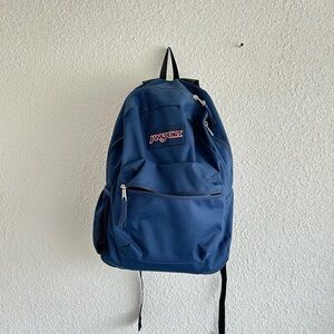dark blue Jansport backpack